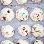 White cake mix cookies, baked on a sheet pan with parchment paper.
