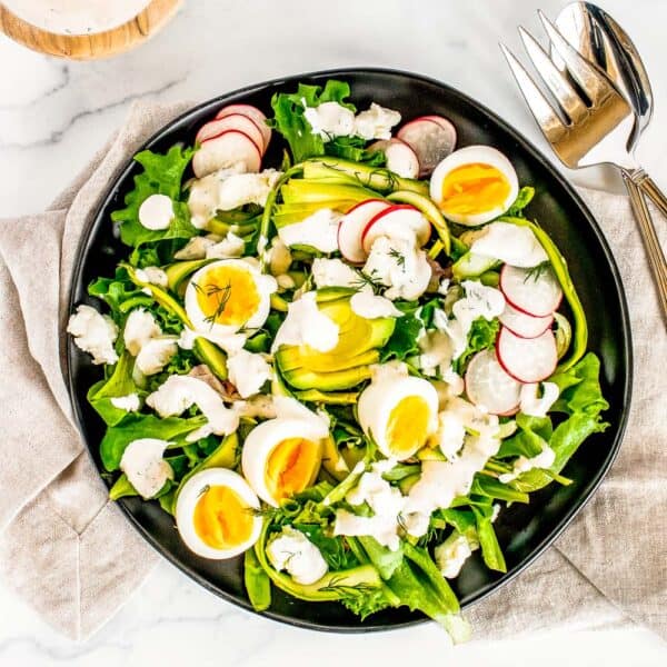 top down shot of a spring salad with buttermilk dressing