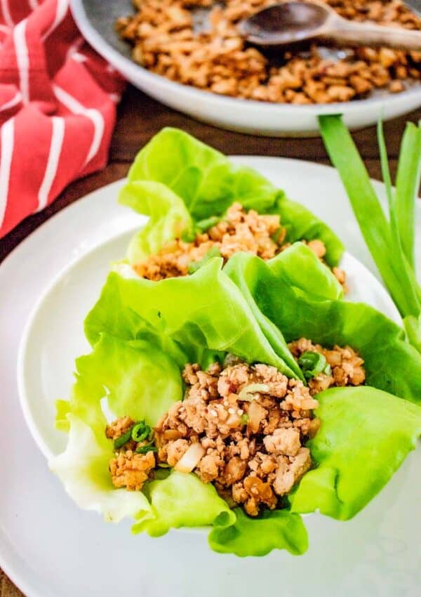 asian chicken lettuce wraps shown on a plate