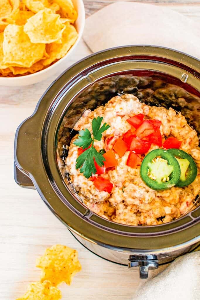 Rotel sausage dip shown in a crockpot