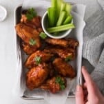 BBQ Chicken Wings in a basket with celery