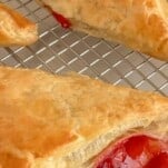 cherry turnovers with puff pastry on a wire rack