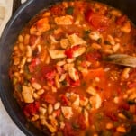 chicken white bean soup in a cast iron skillet