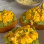 scrambled egg avocado toast on a tray