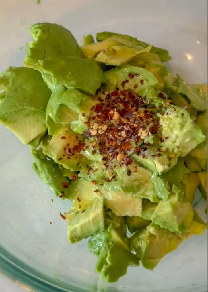 guacamole with a sprinkle of sea salt flakes