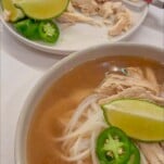 a photo of chicken pho up close in a bowl