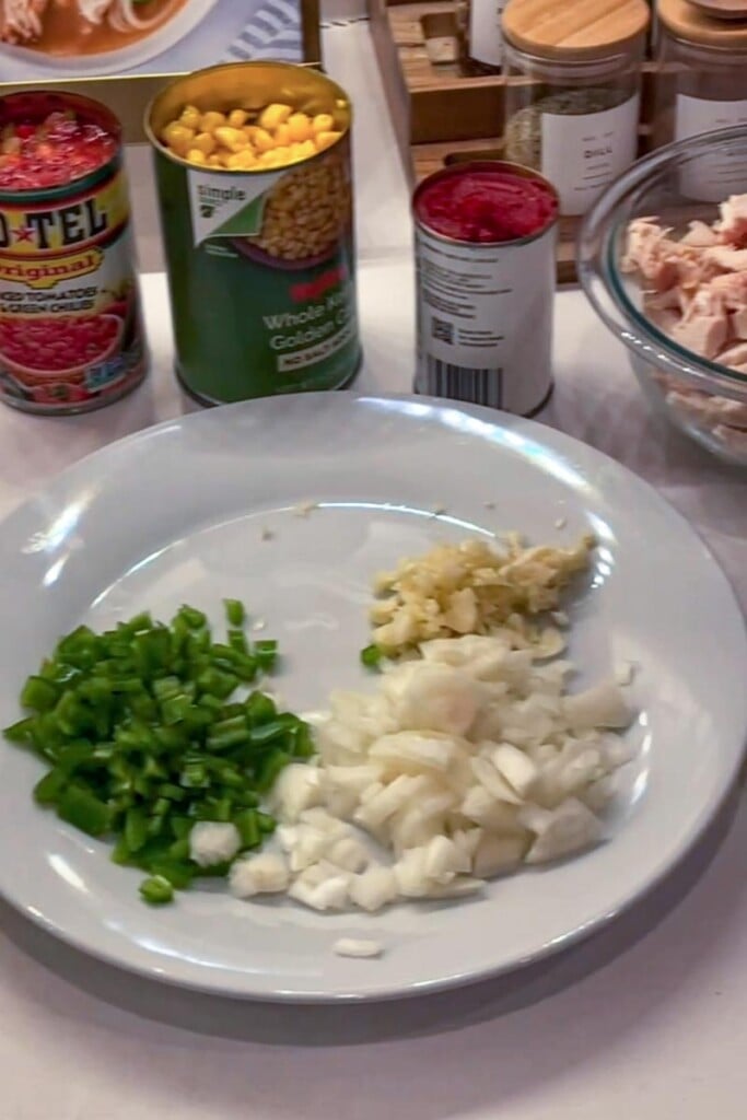 chopped onion, peppers and garlic on a plate
